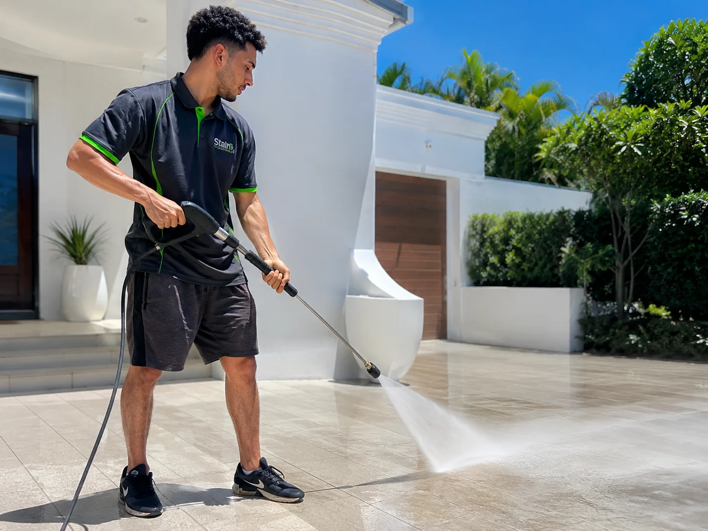 Professional pressure washing at a modern Gold Coast property